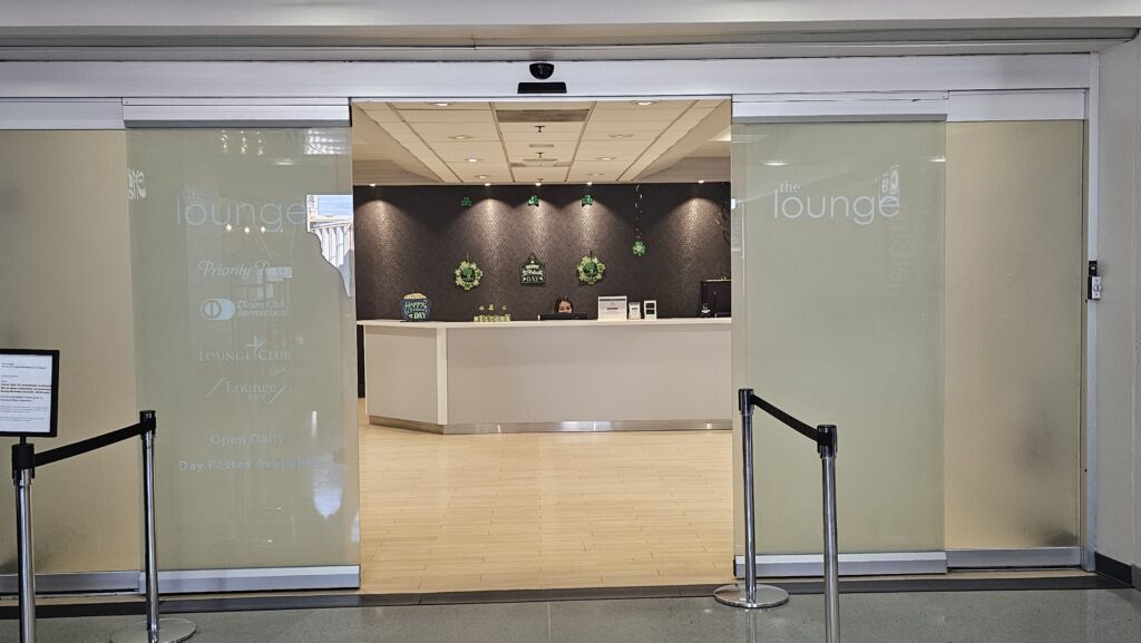 a glass door with a reception desk in front of it