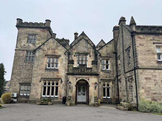 a stone building with a stone wall and a stone door