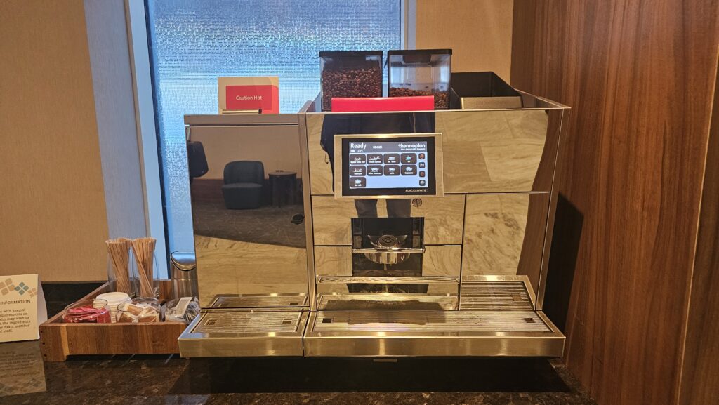 a coffee machine with a screen and a screen