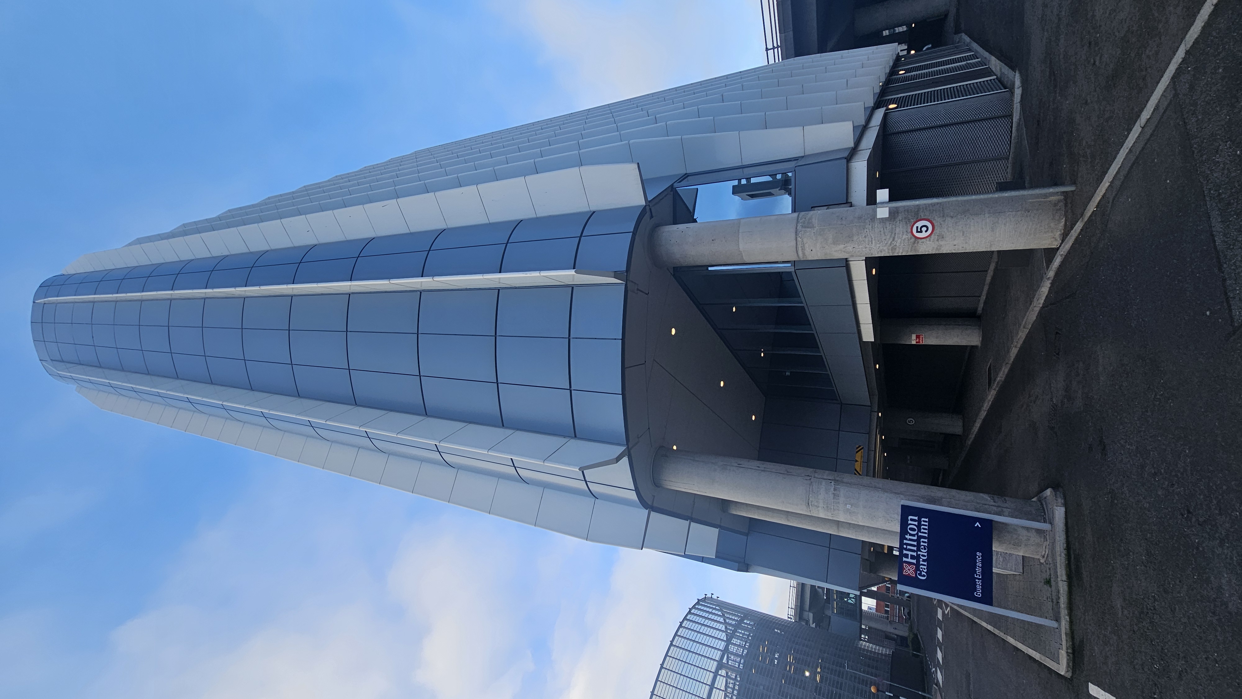 a tall building with a blue sky