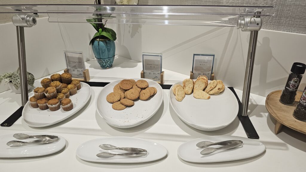 a plate of cookies and muffins on a table