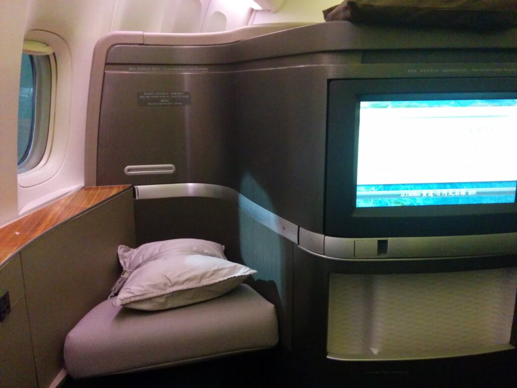 a tv on a chair in a plane