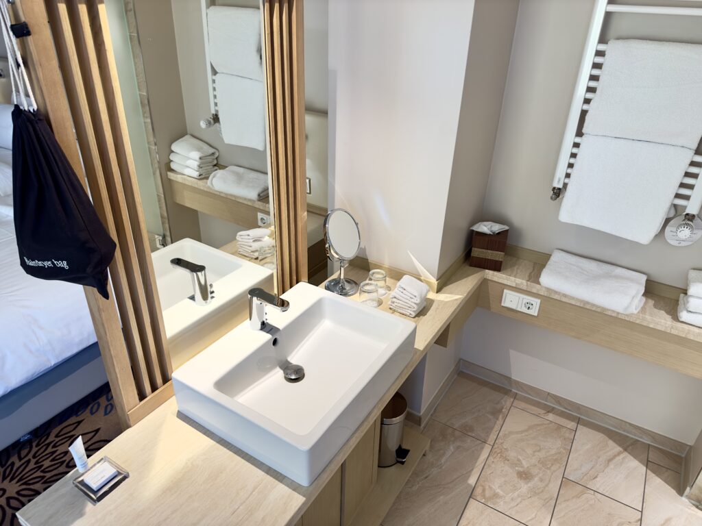 A bathroom vanity with sink in a hotel room.