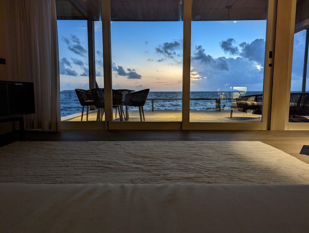 a room with a view of the ocean from the window