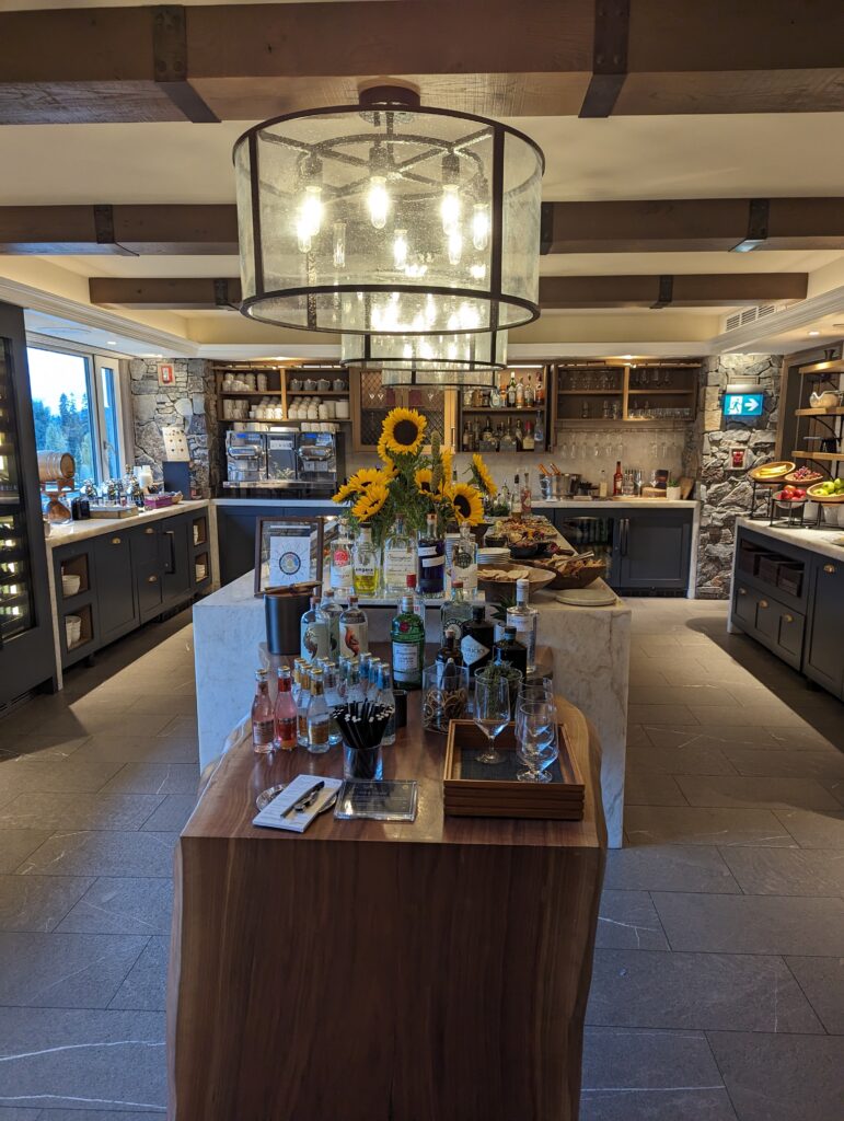 a bar with bottles of alcohol and sunflowers