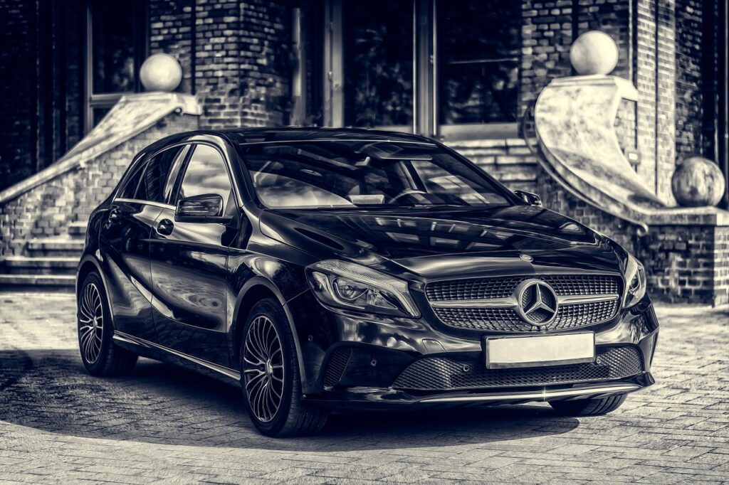 a black car parked in front of a building