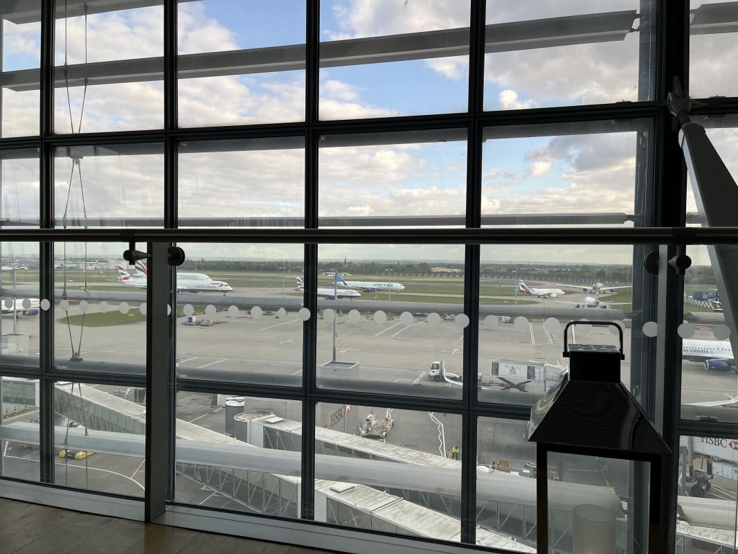 a window with many airplanes in the background