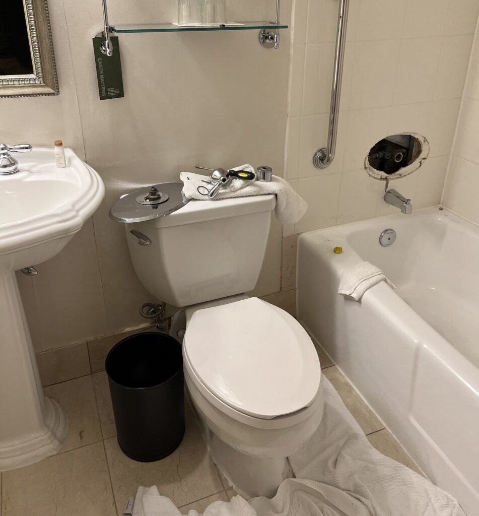 a bathroom with a toilet and tub