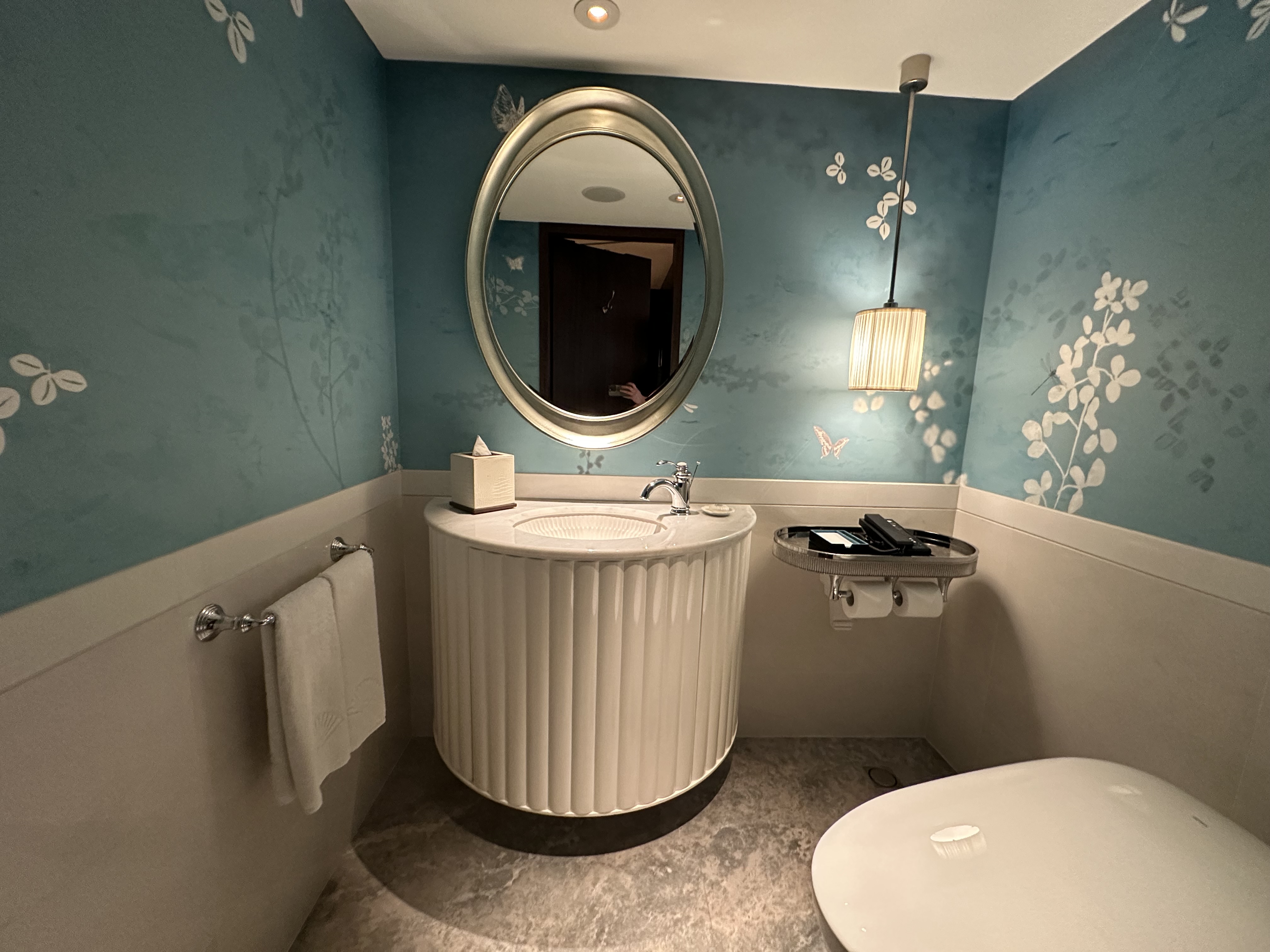 a bathroom with a sink and a toilet at the Mandarin Oriental Taipei