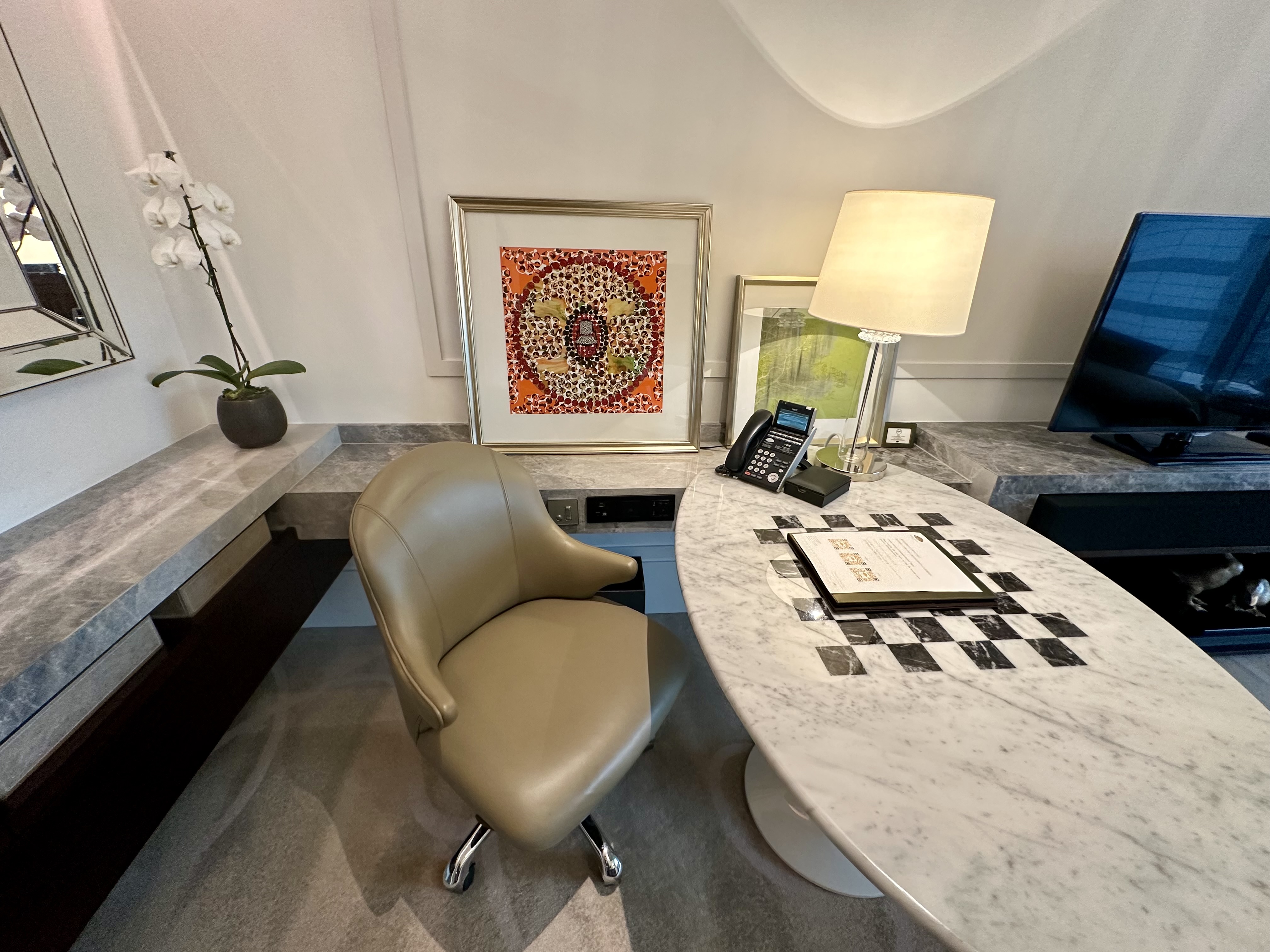 a chair and a desk in a room at the Mandarin Oriental Taipei