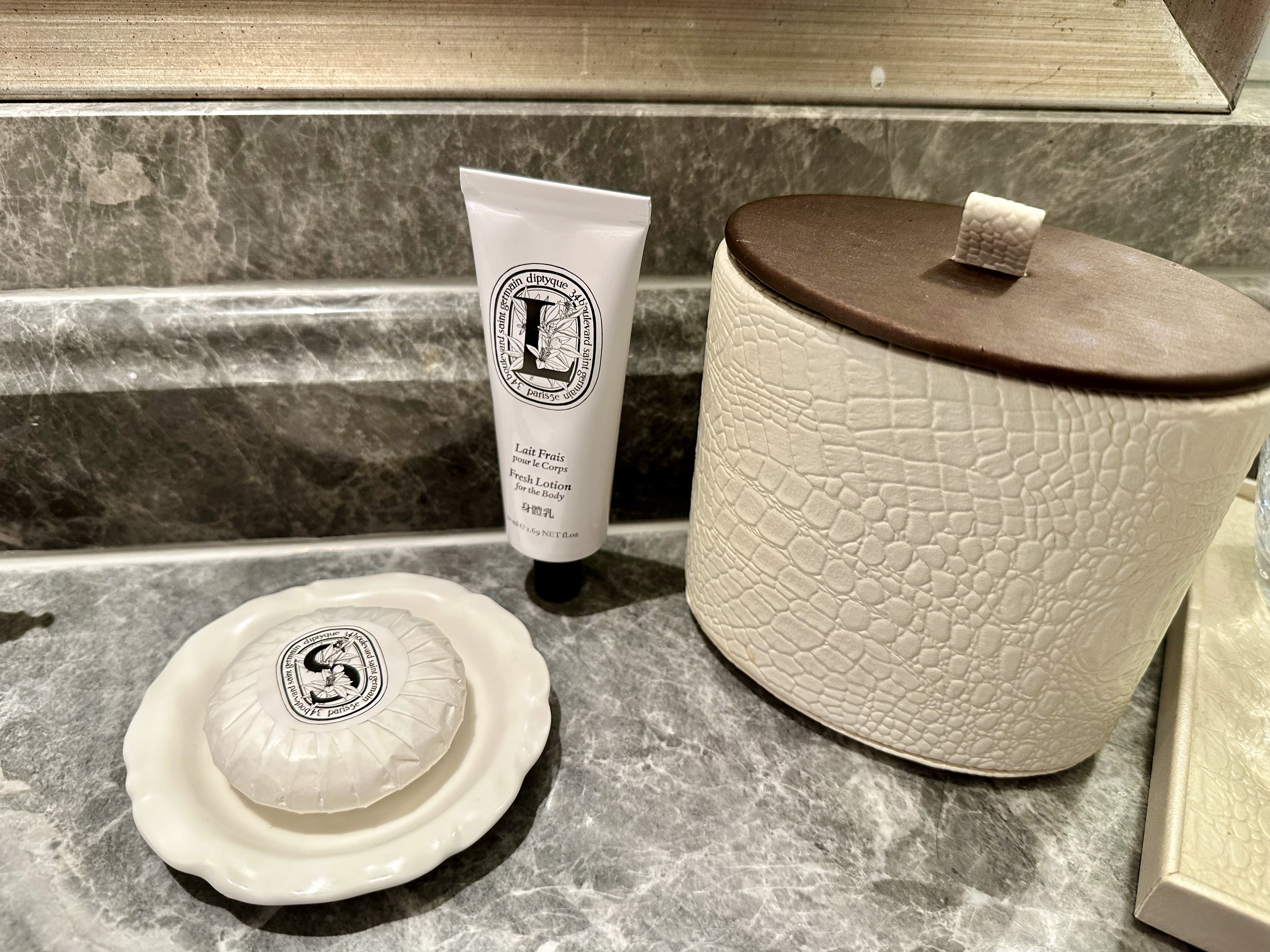 a soap and a tube of cream on a counter