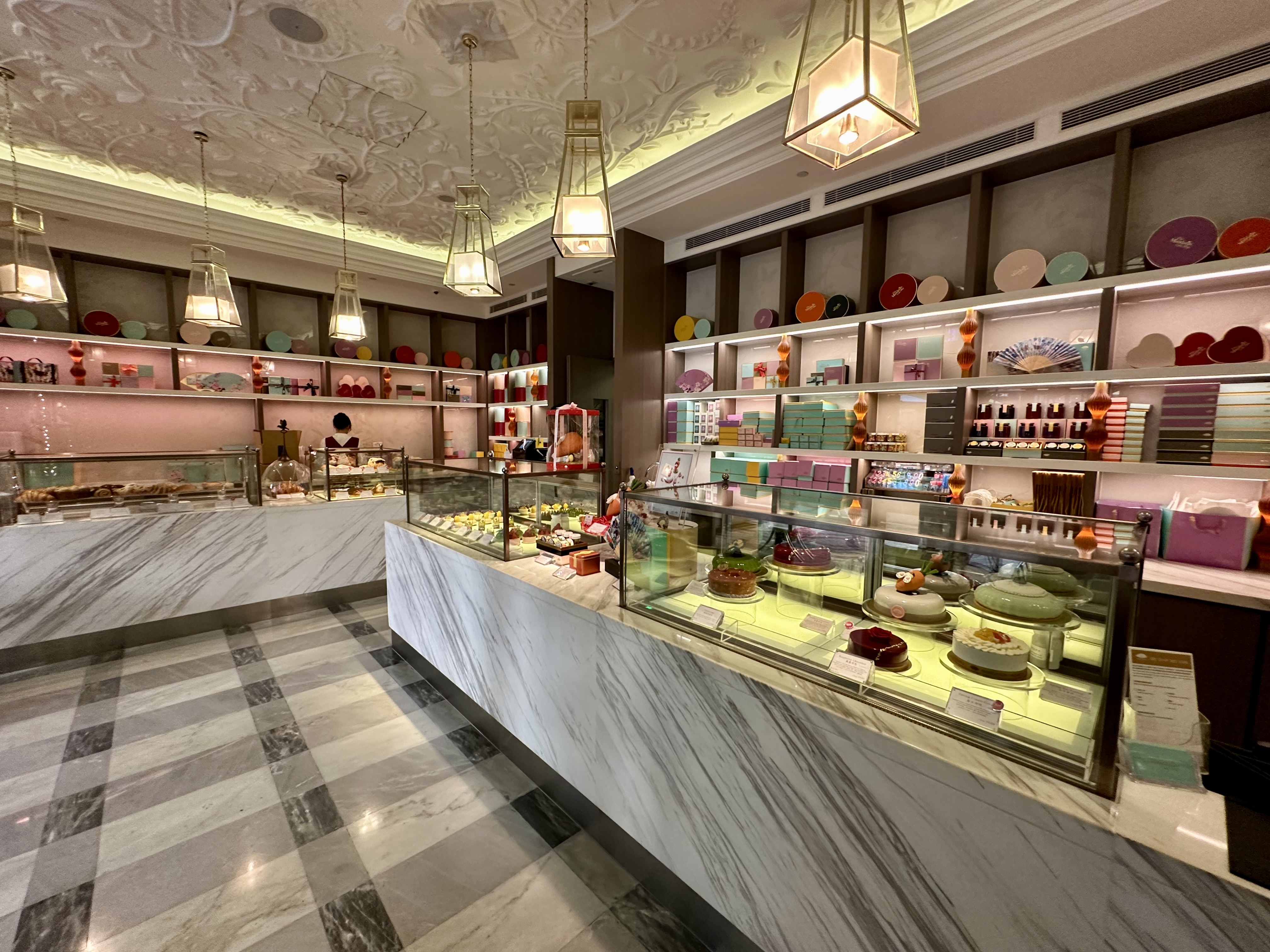 a room with a counter and shelves with food