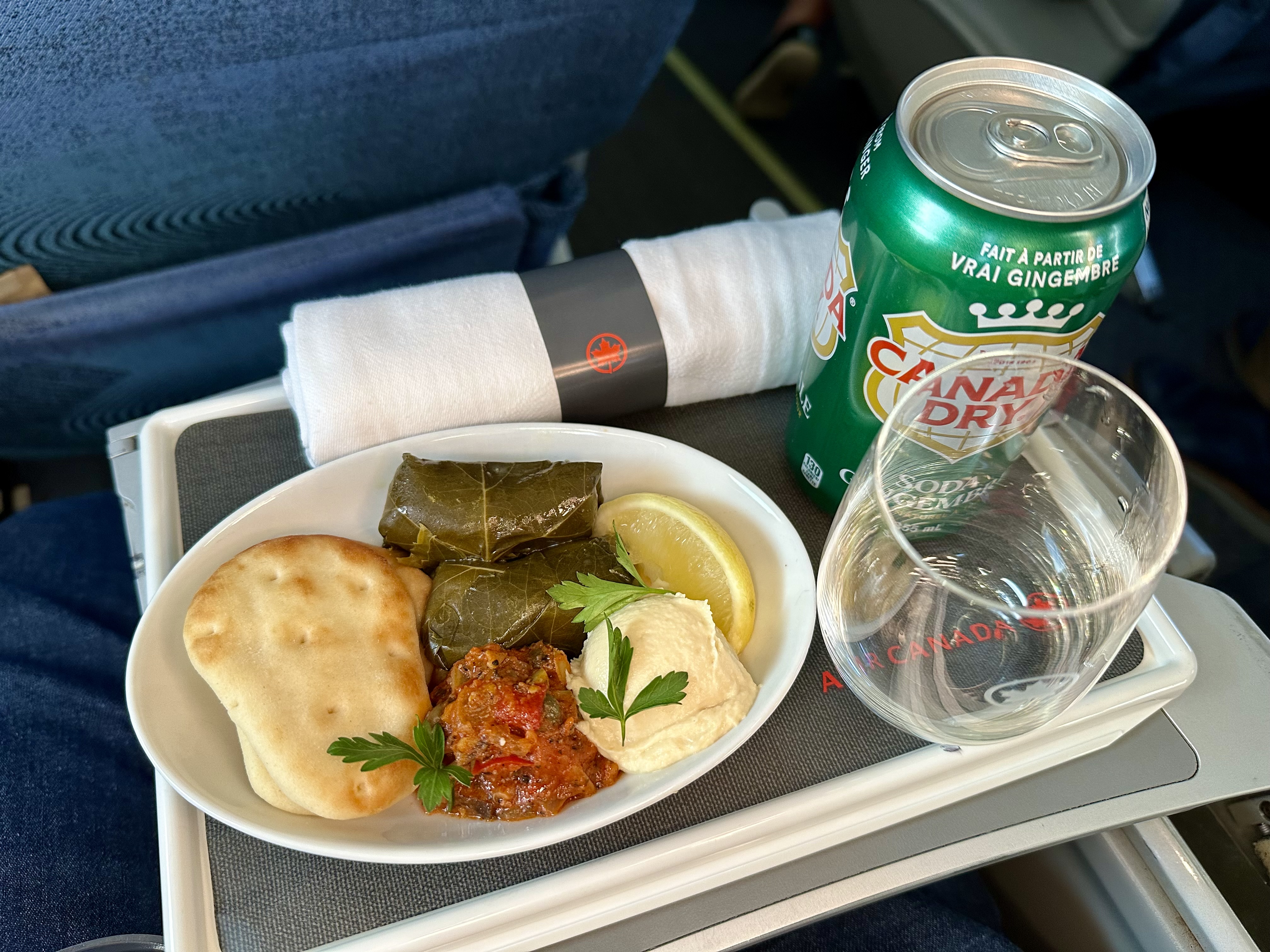 a plate of food on Air Canada Jazz Business Class