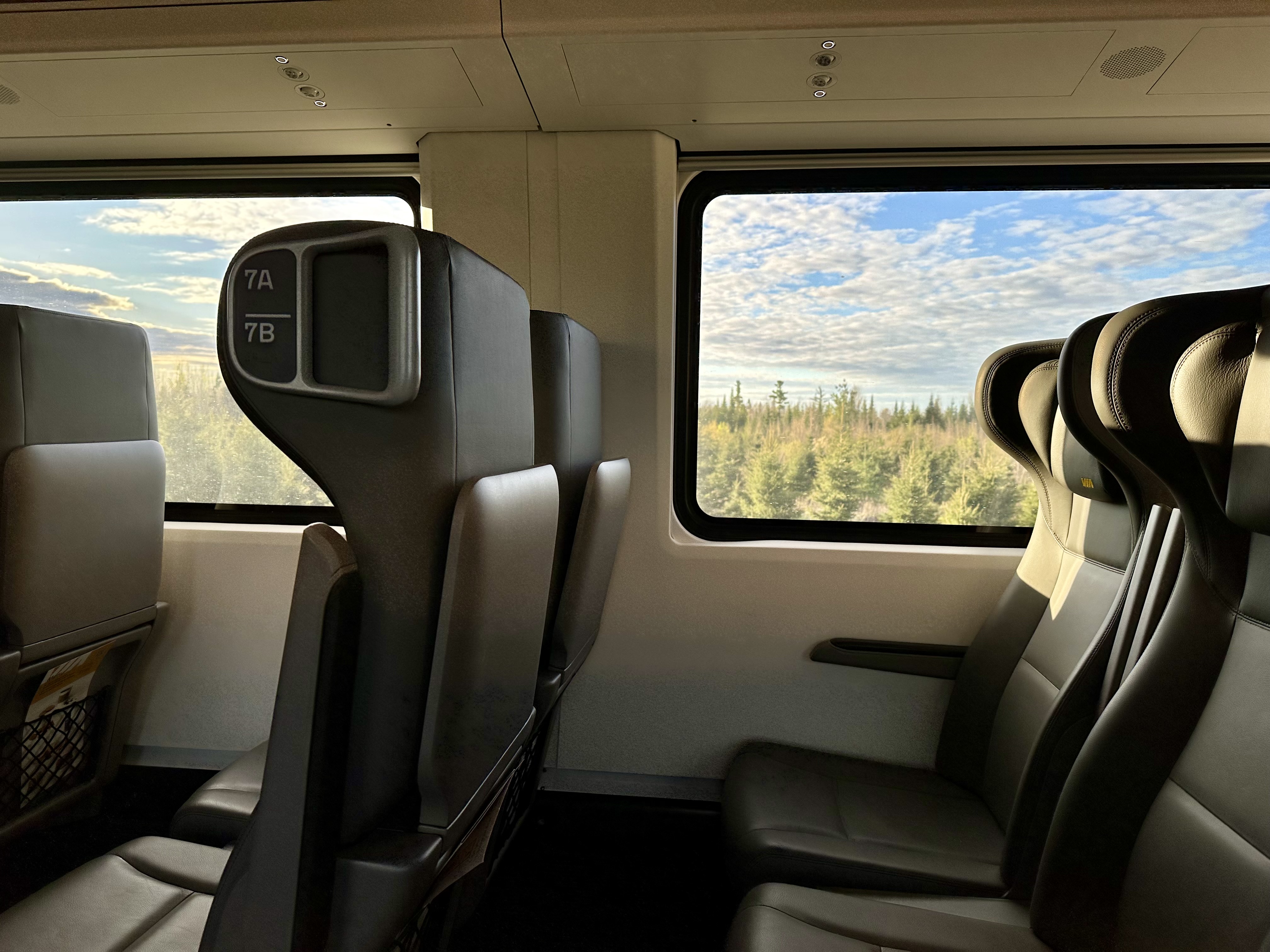 a VIA Rail Train with seats and windows