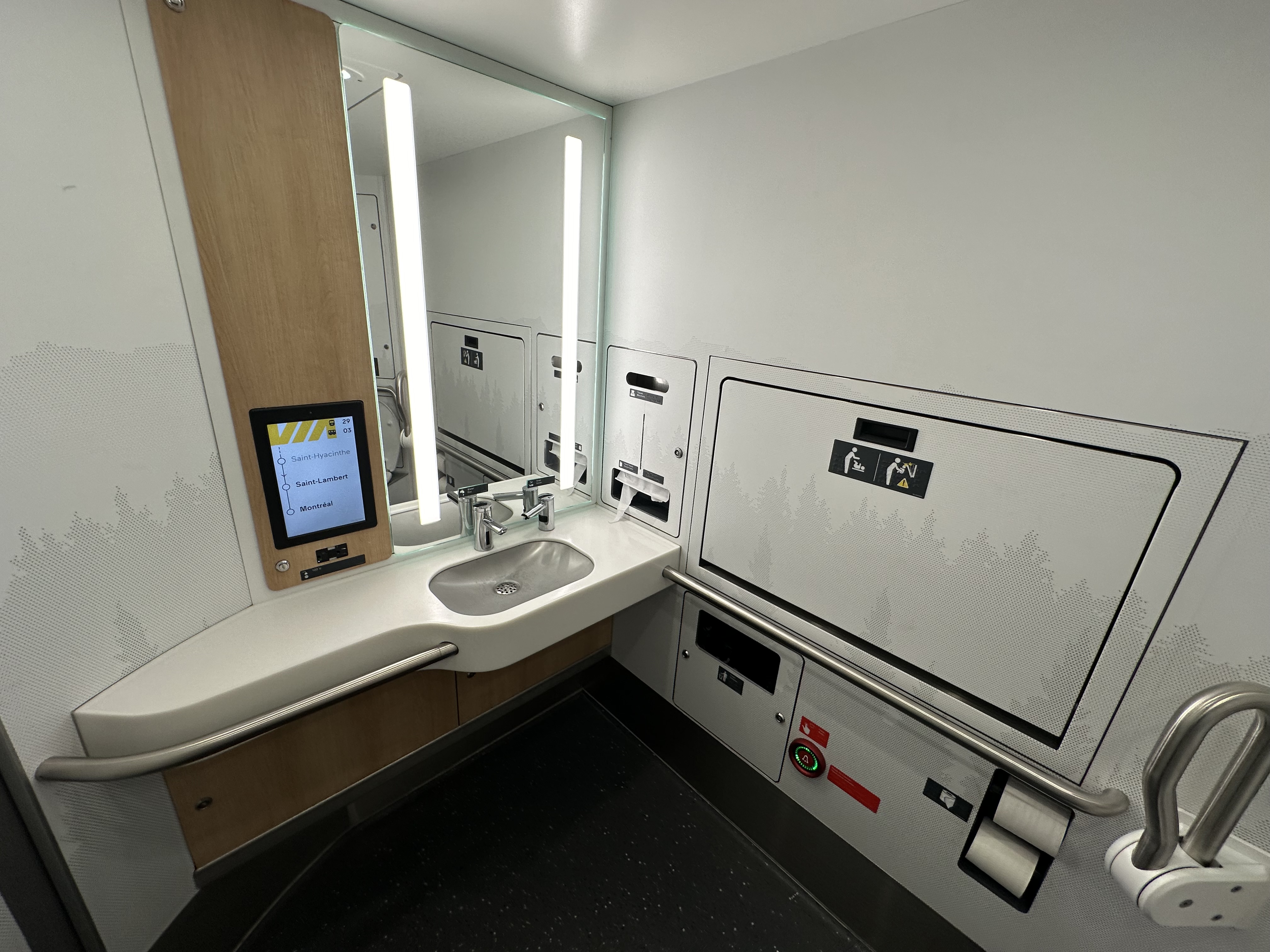 a bathroom with a mirror and sink on VIA Rail Canada