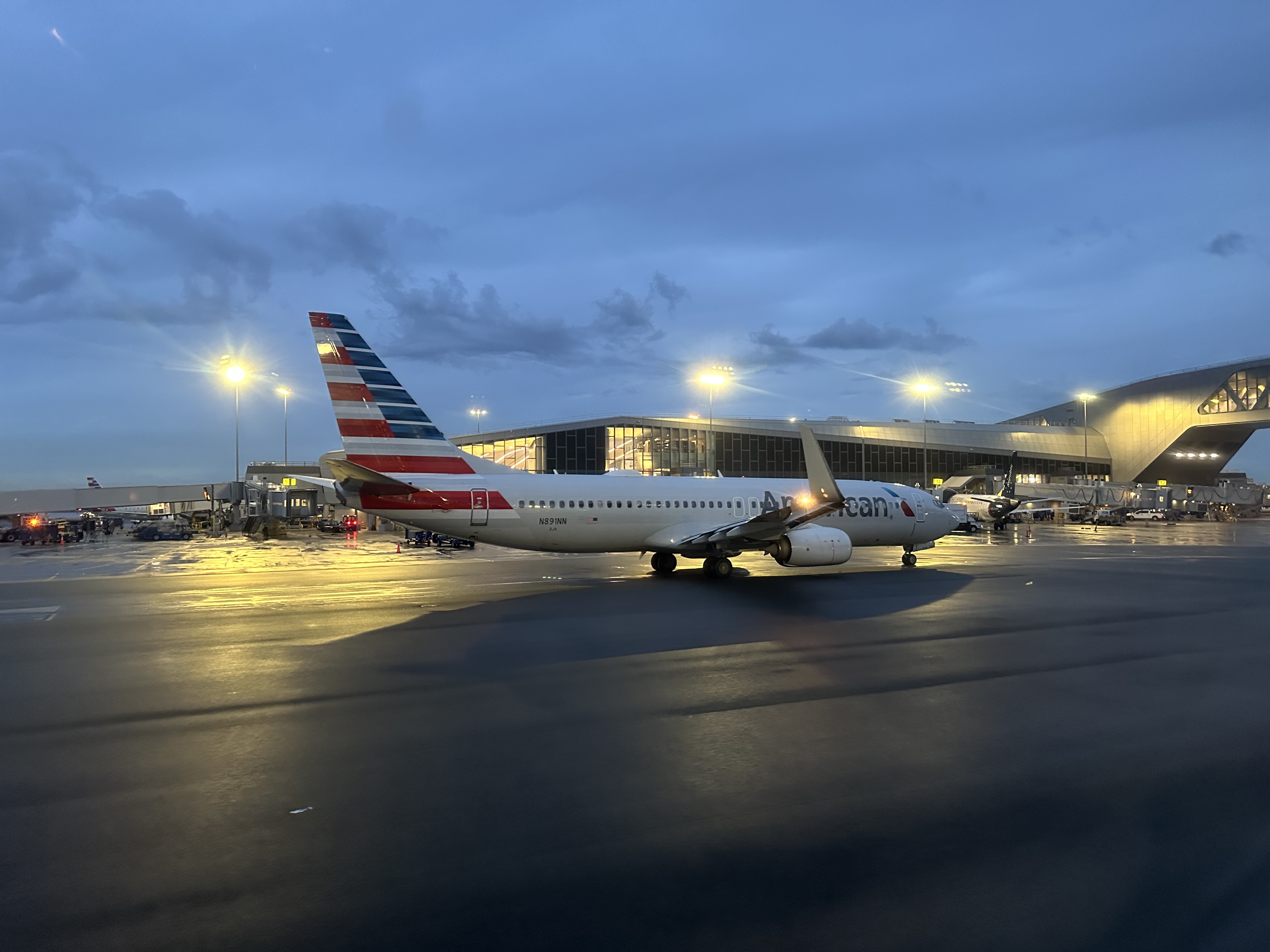 an airplane on the runway booked with Capital One Travel