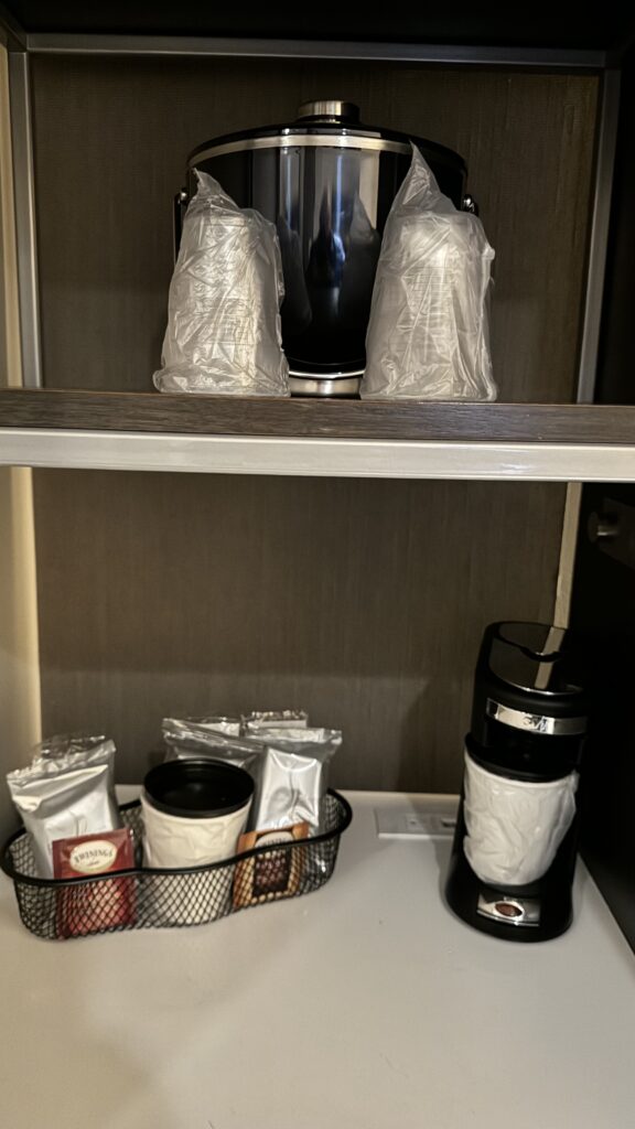 a coffee maker on a shelf