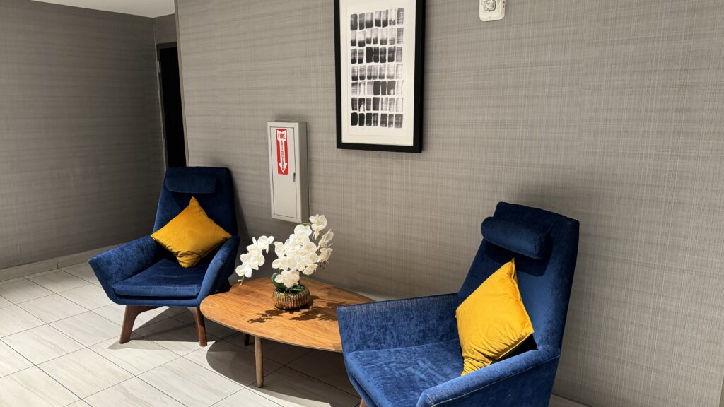 a blue chairs and a coffee table in a room