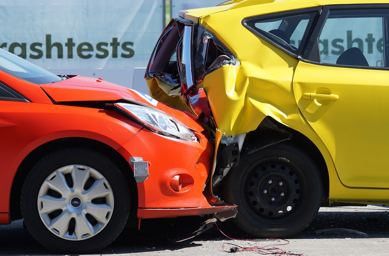 a car crash with a yellow car