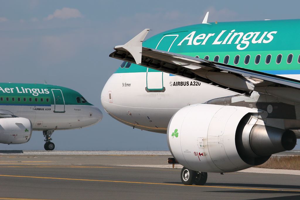 a couple of airplanes on a runway