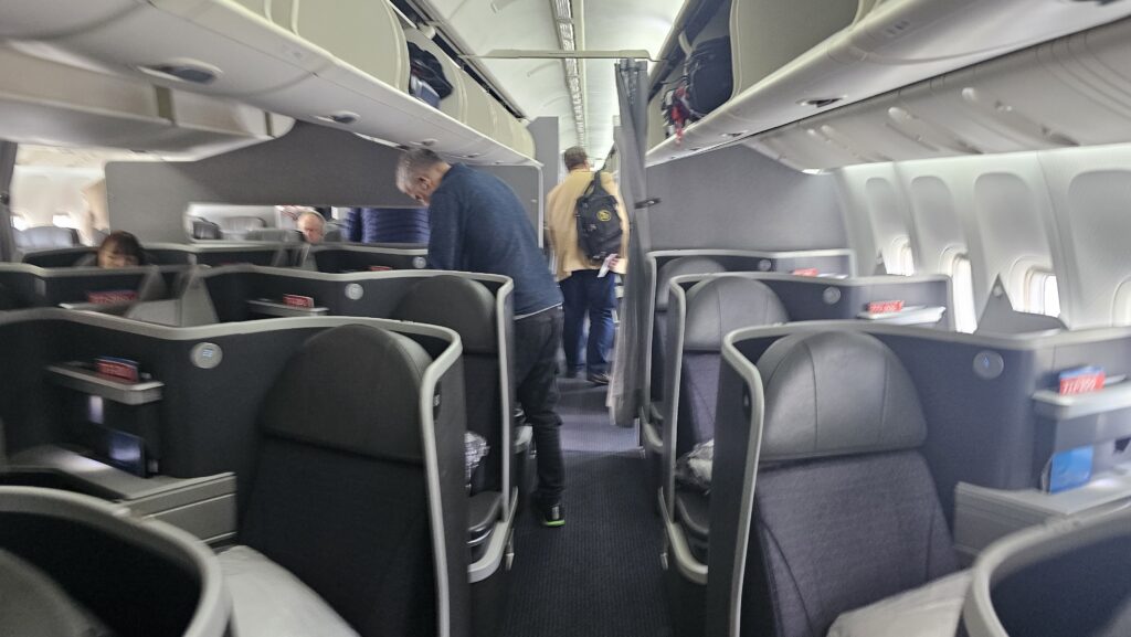 people inside a plane with people on the seats