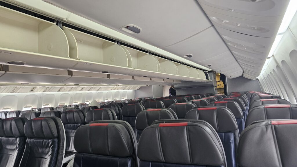 a plane with seats and a person sitting in it