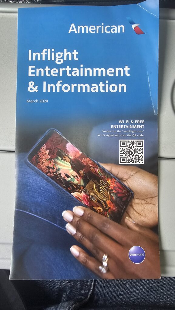 a blue and white cover with a hand holding a cell phone