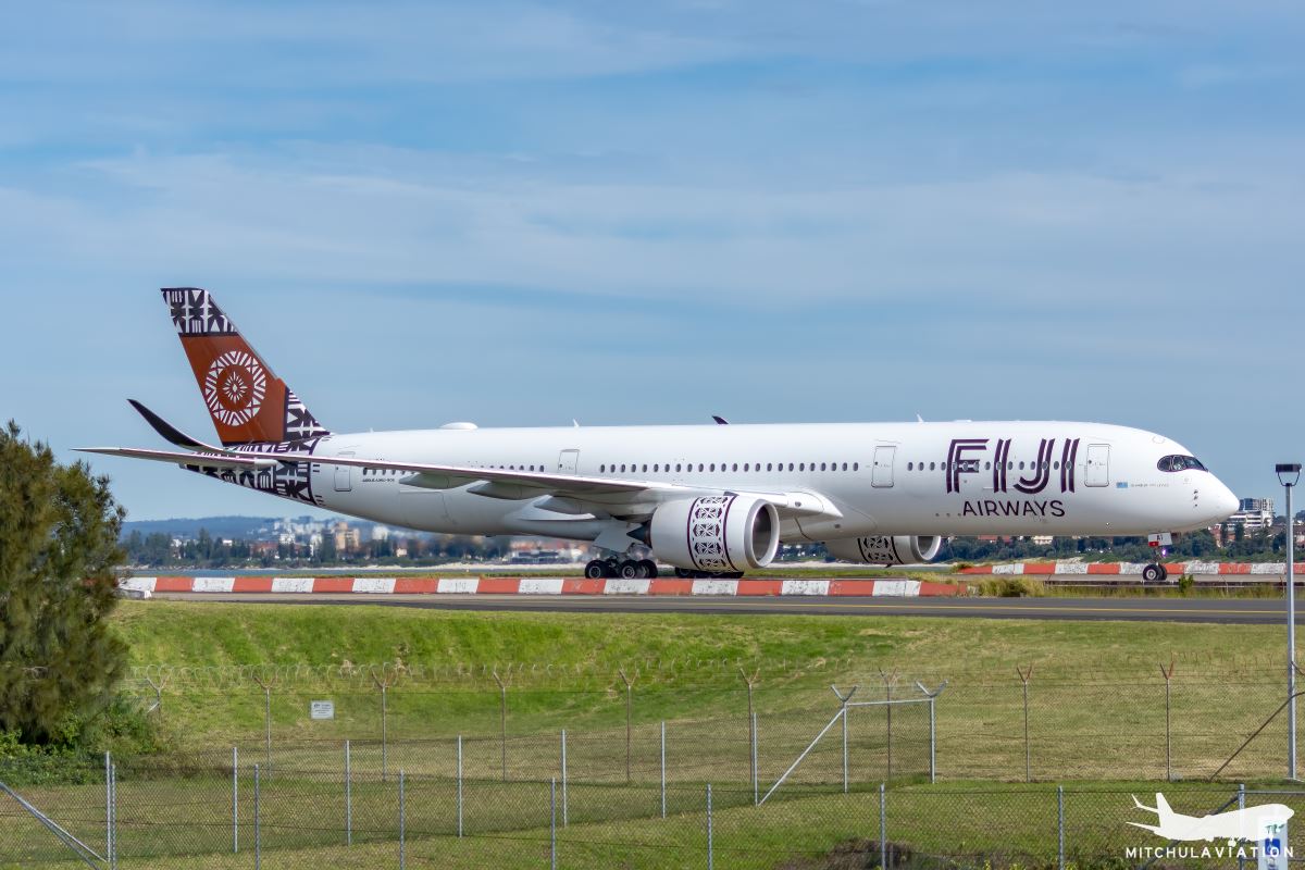 a large white airplane on a runway