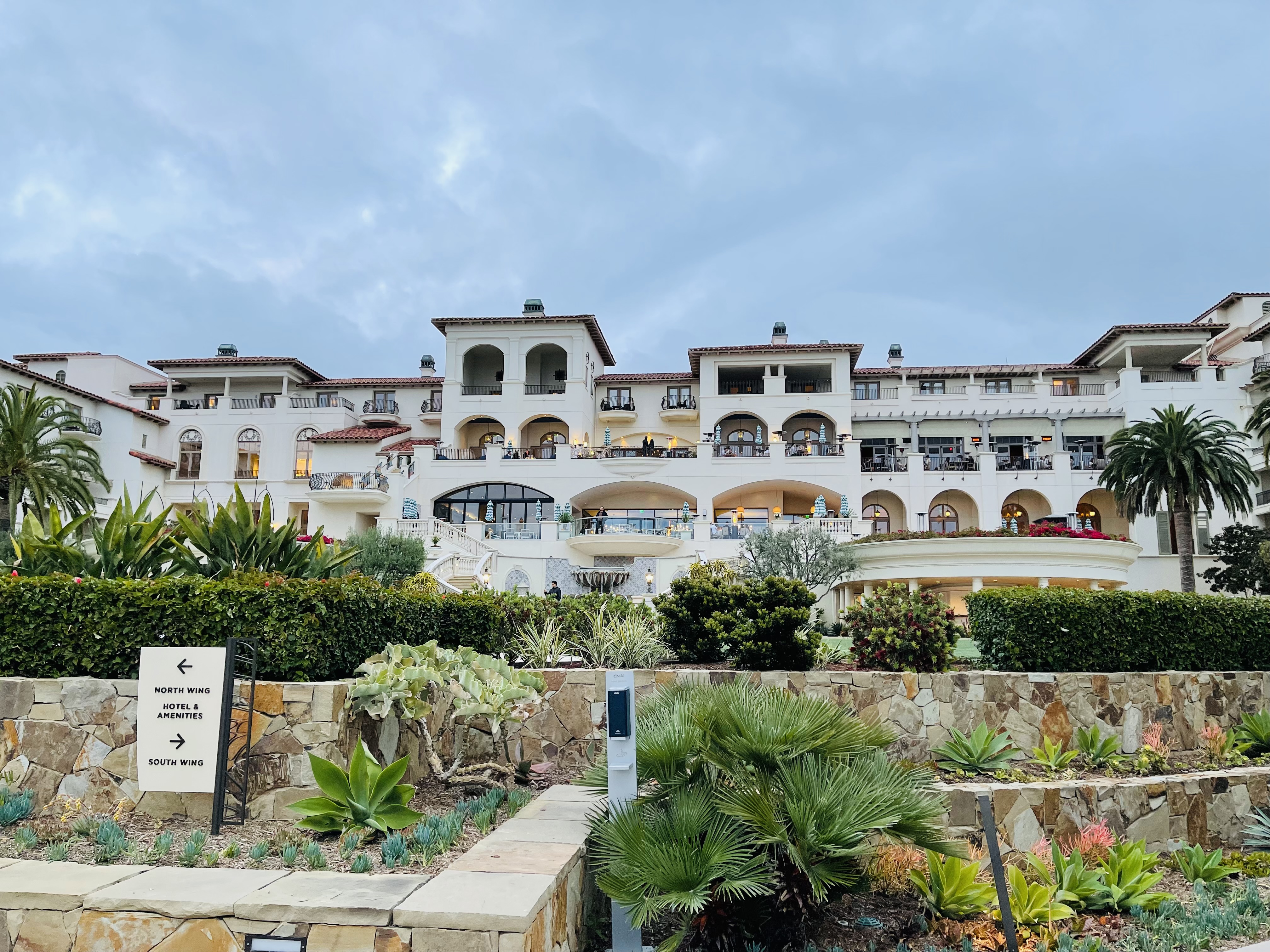 a large white building with many balconies