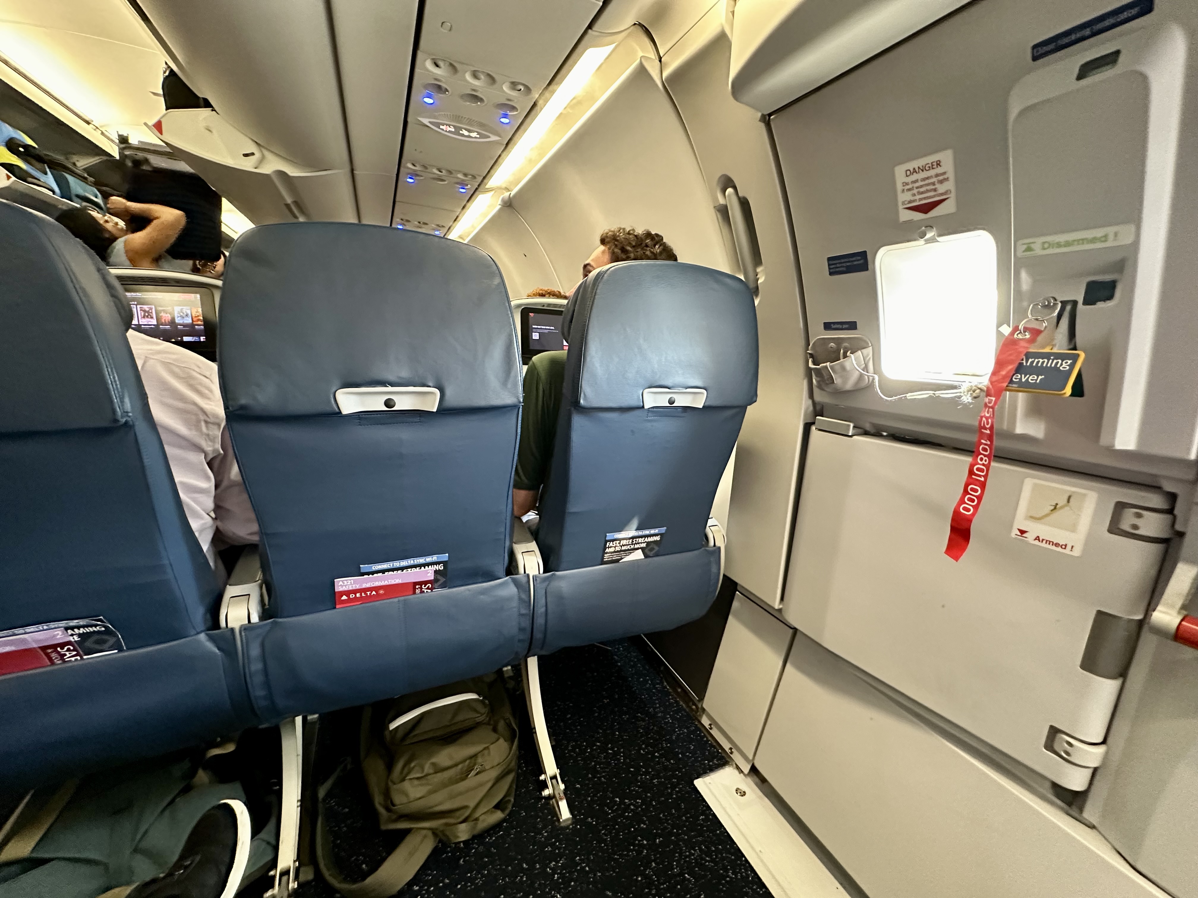 a group of people sitting in an airplane