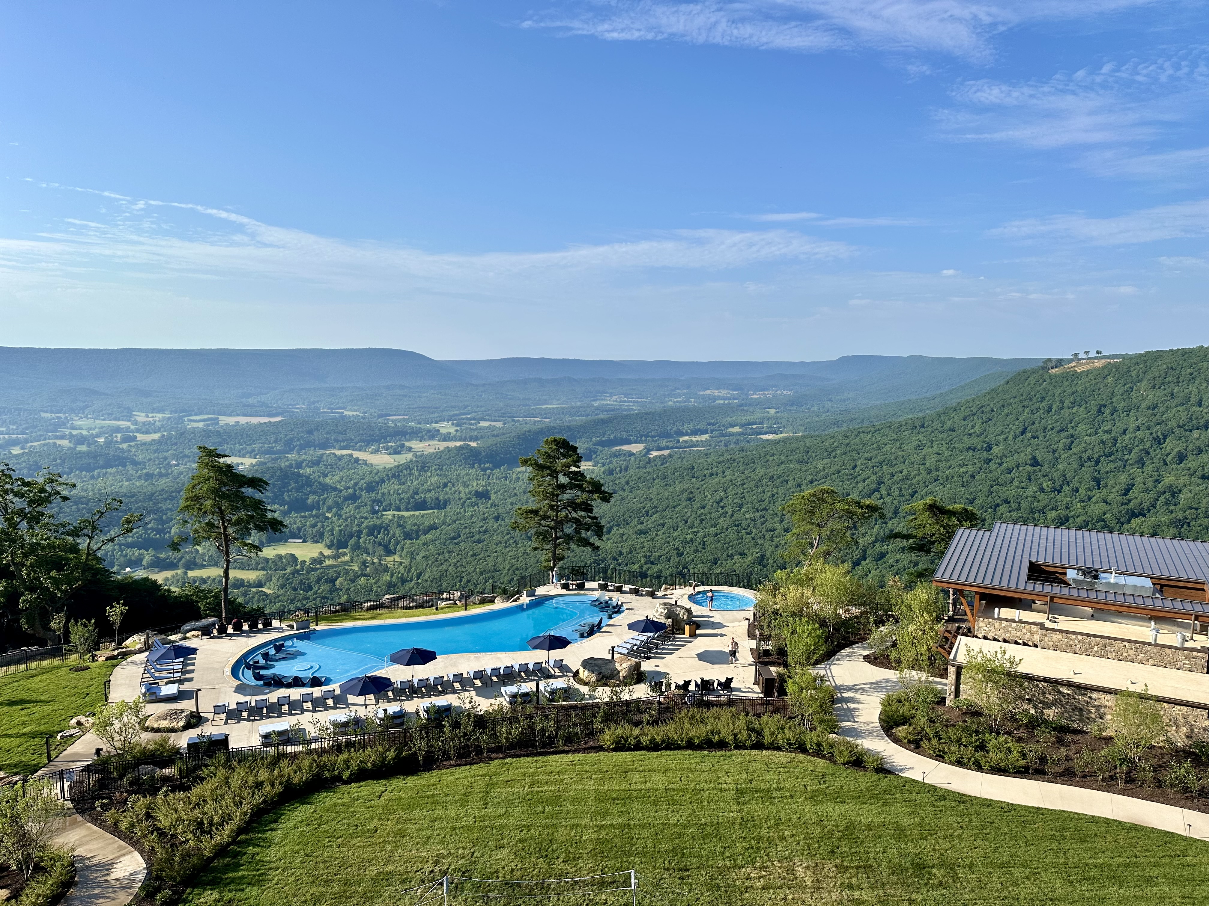 a pool and a view of a valley