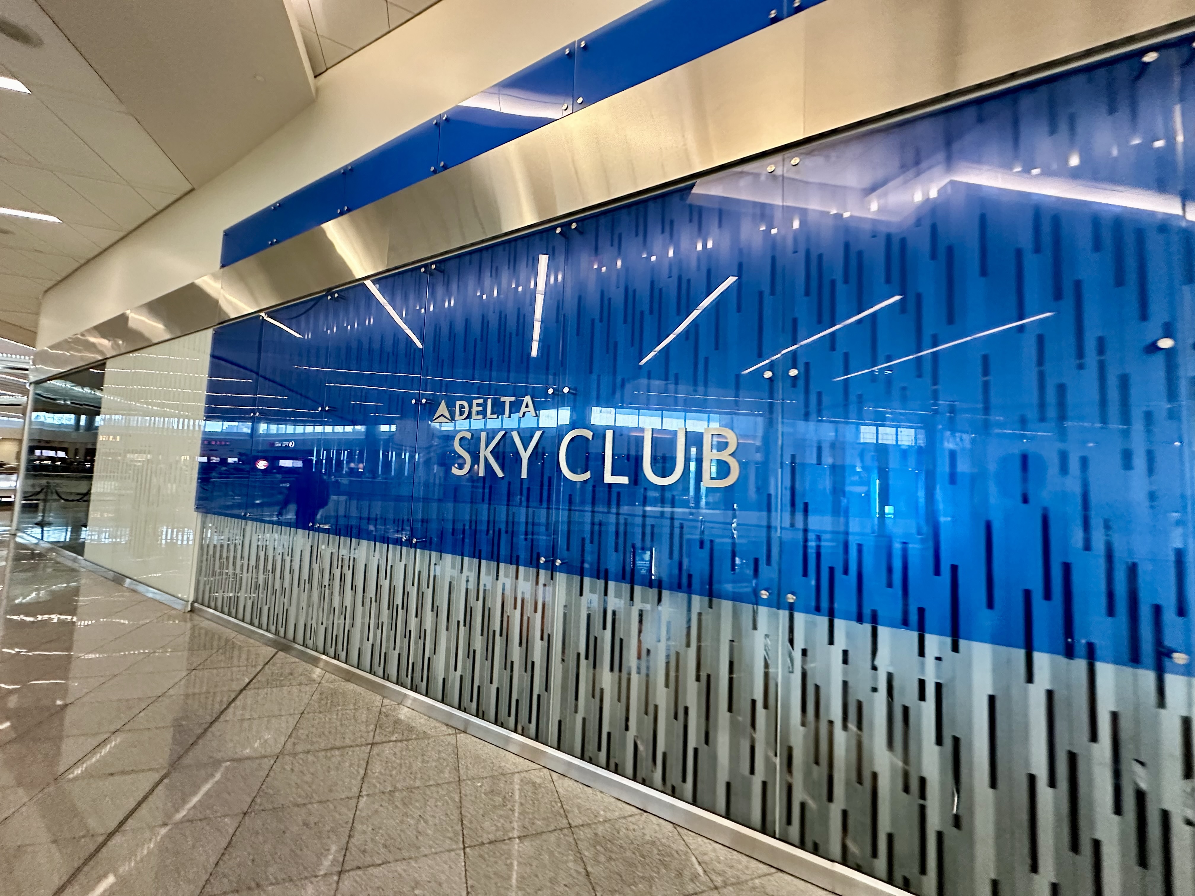 a blue and silver sign on a wall