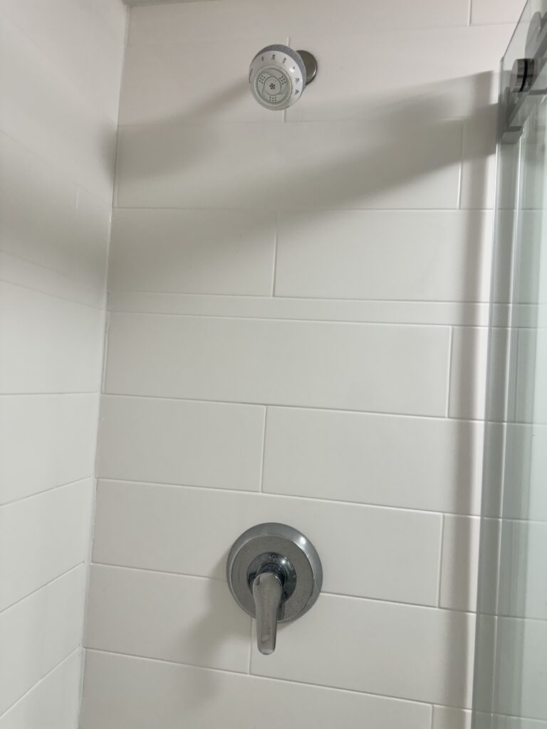 a shower head in a bathroom