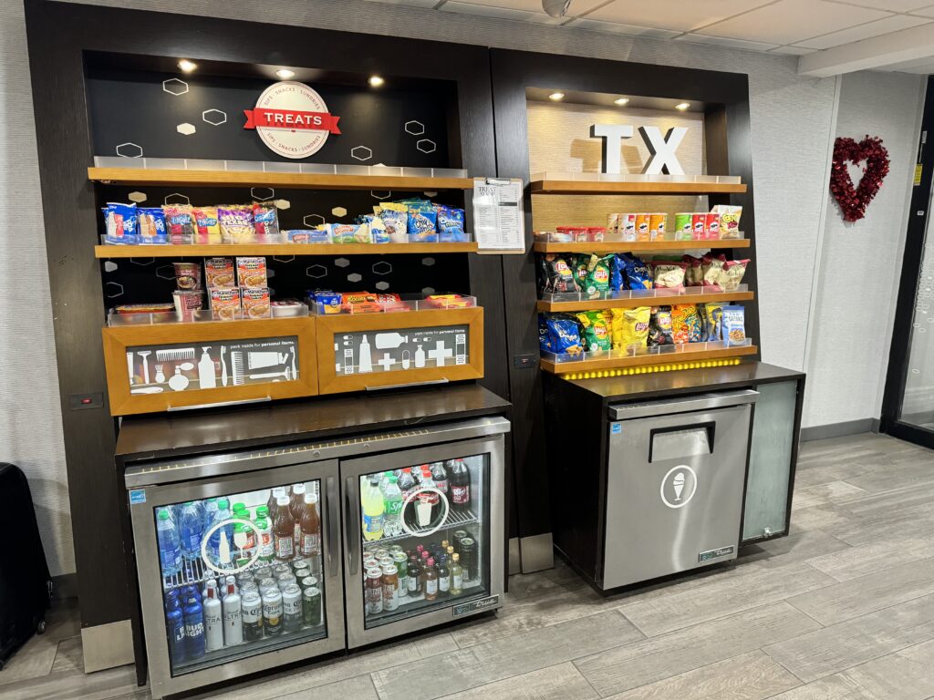 a shelves of snacks and drinks in a store