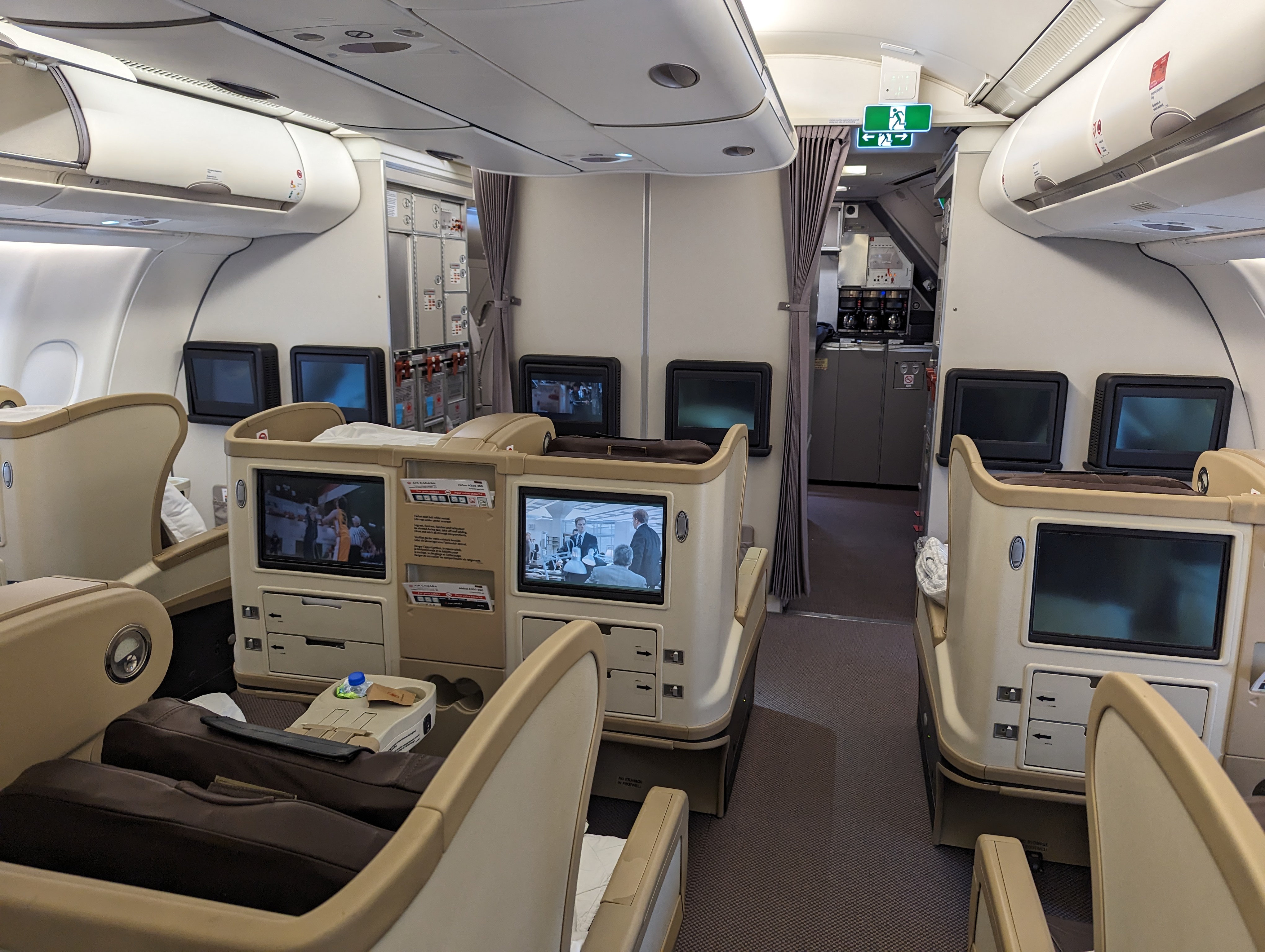 the inside of an airplane with a television set