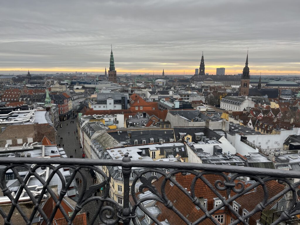 a city with many buildings and a fence