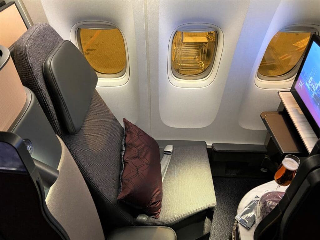 Book Qatar Airways Quites using American Airlines AAdvantage miles. Picture is a Qatar Airways QSuite.