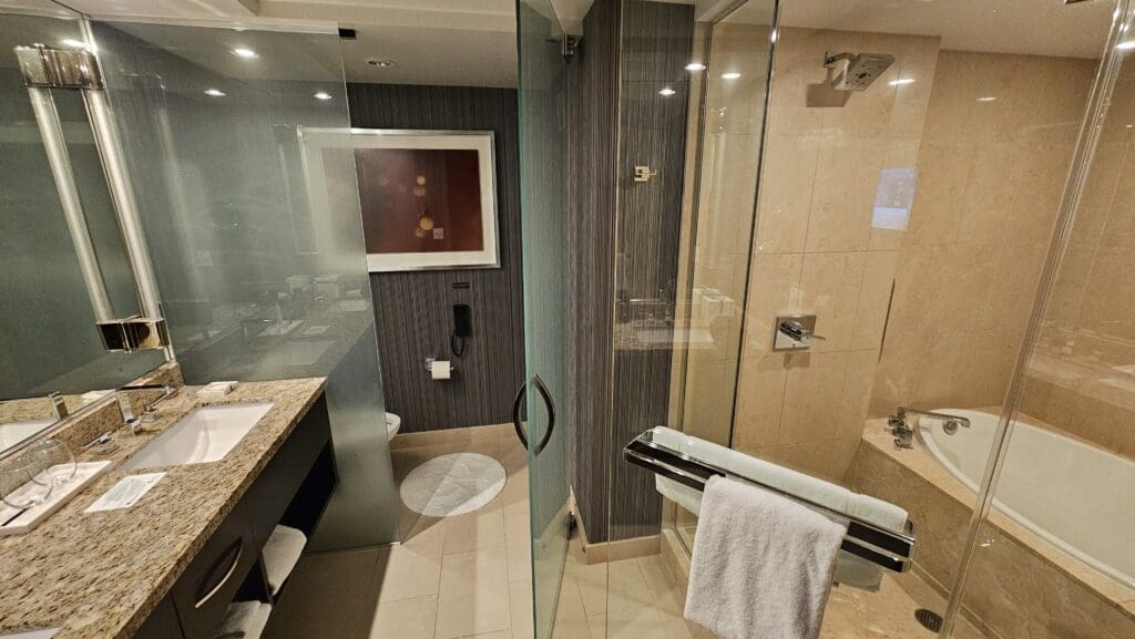 a bathroom with glass shower doors