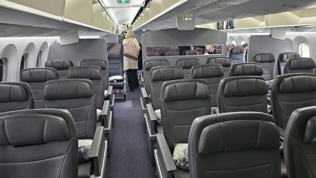 a woman standing in an airplane