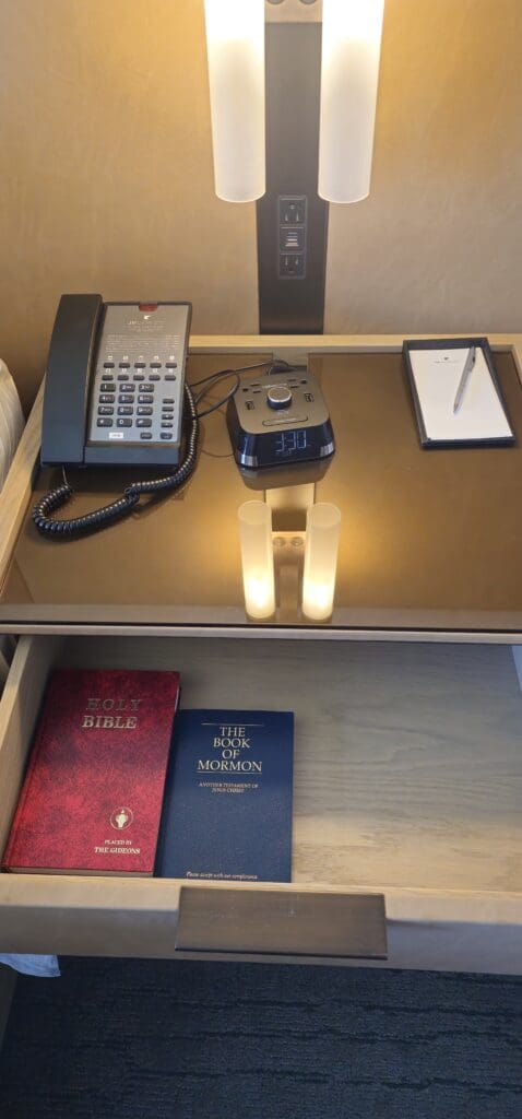 a telephone and a pen on a table