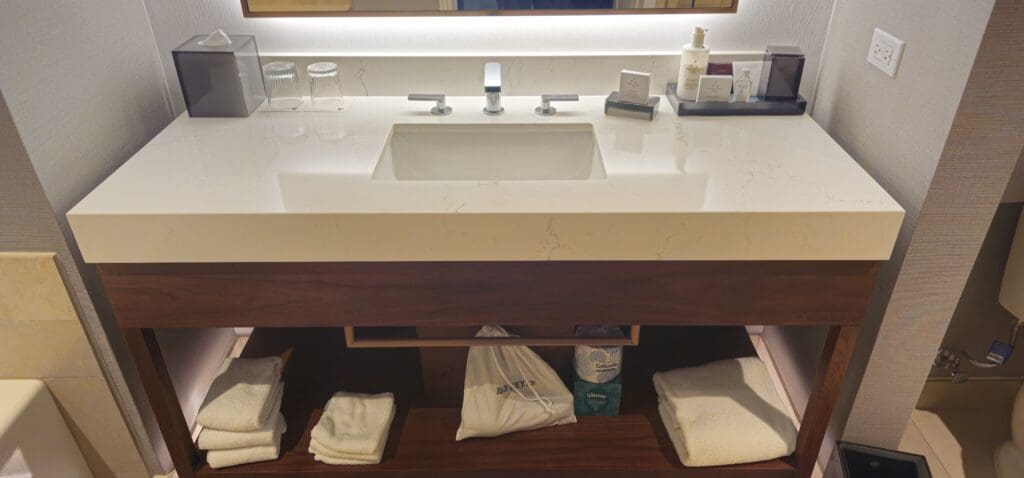 a sink and towels on a counter