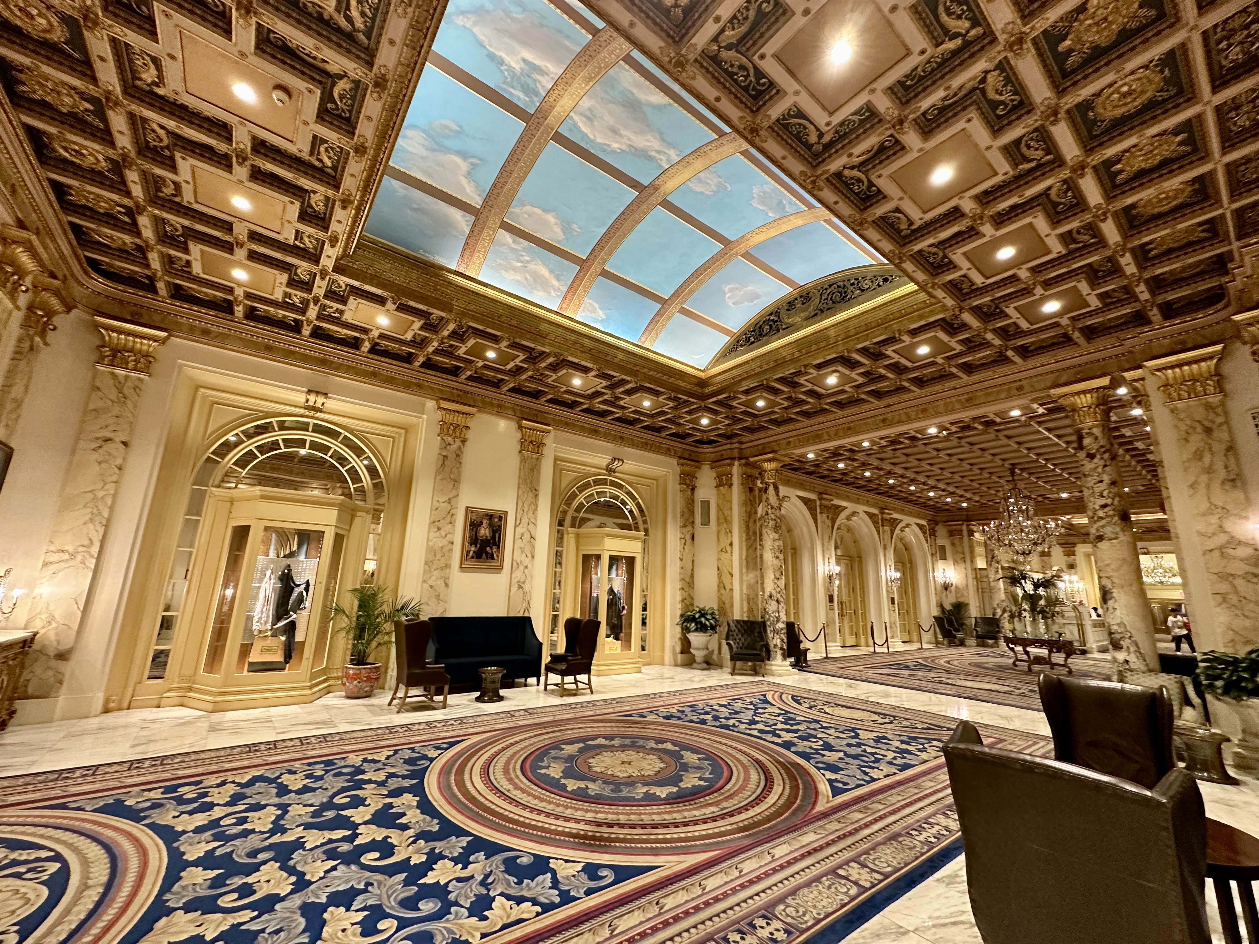 a large ornate room with a blue carpet and a blue ceiling at the Fairmont Copley Plaza