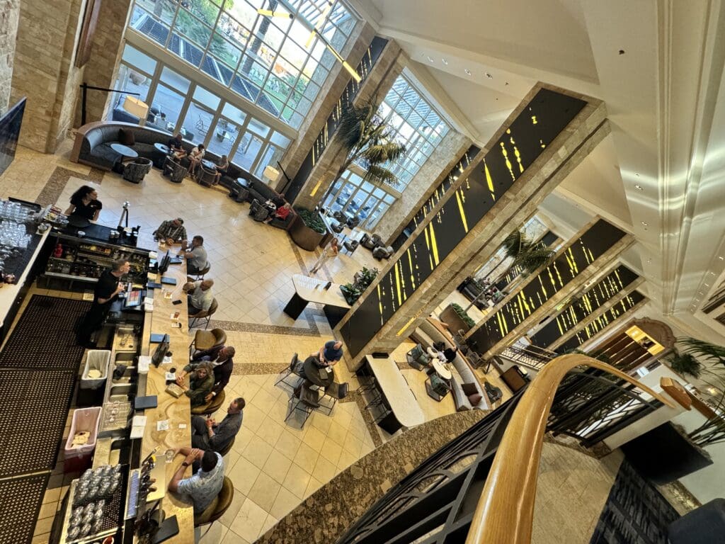 a group of people sitting at tables in a building