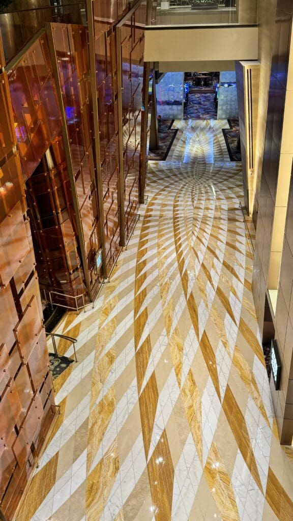 a hallway with a patterned floor