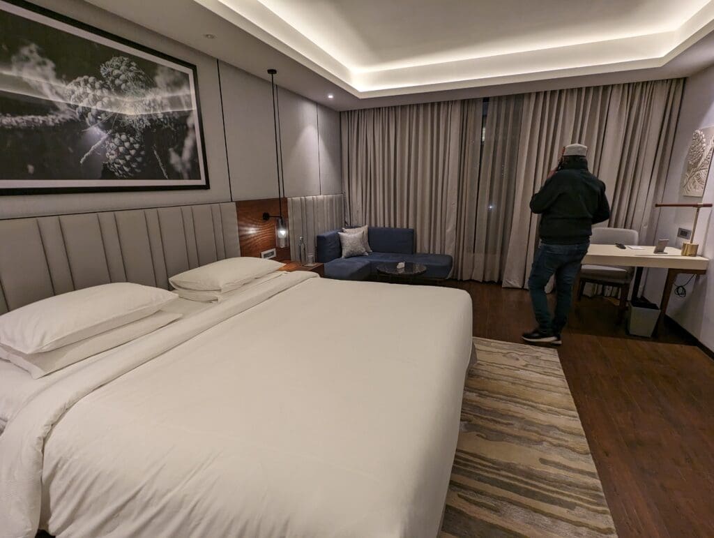 a man standing in a hotel room