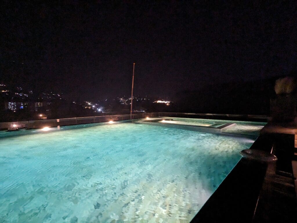 a pool with lights at night