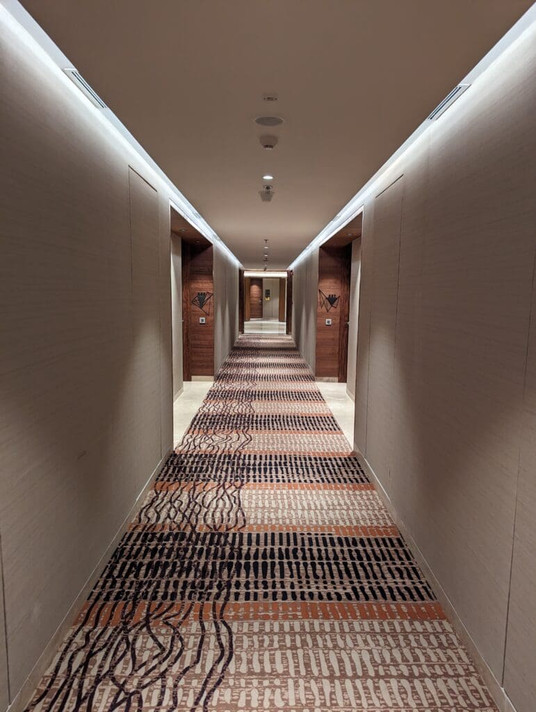 a hallway with a carpeted floor