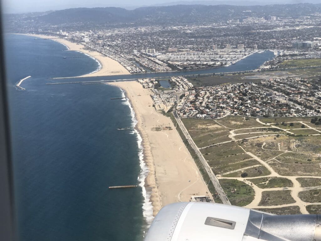 an aerial view of a beach and a city