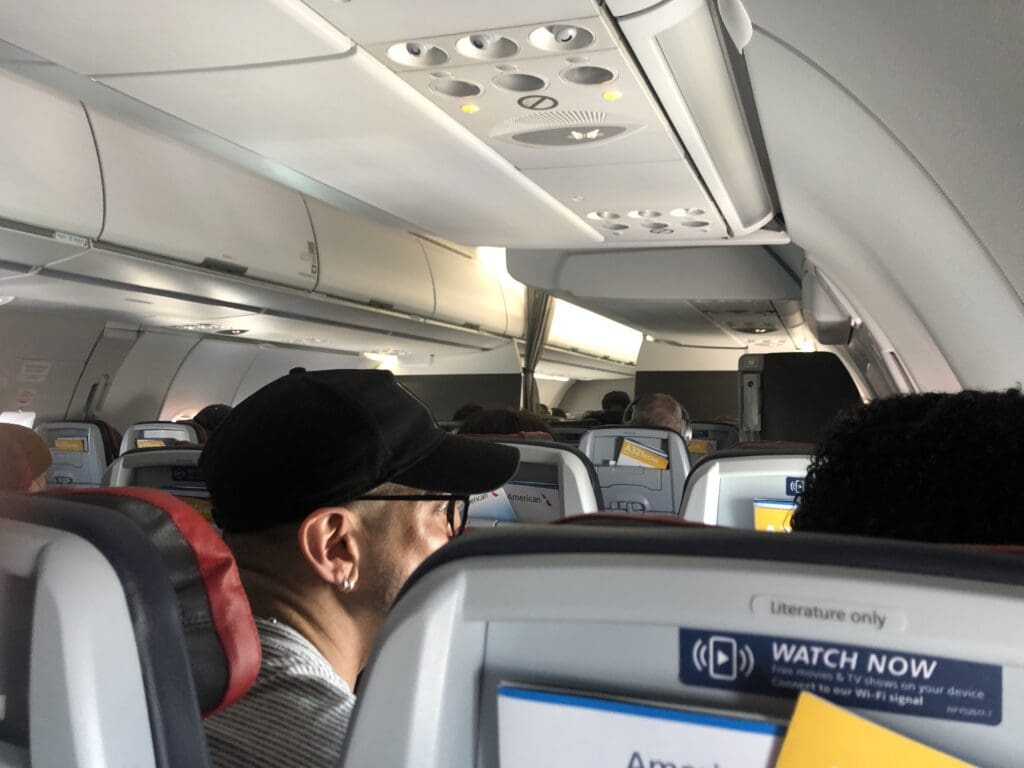 a man sitting in an airplane