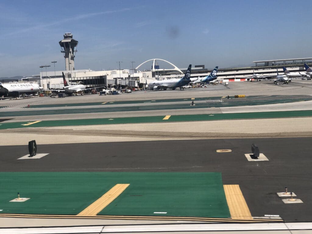 an airport with airplanes on the runway